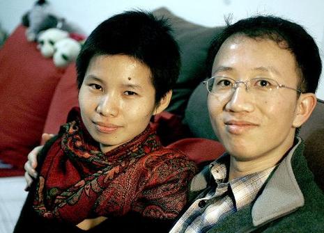 Zeng Jinyan et Hu Jia,©BELGA/AFP/Frederic J. BROWN 